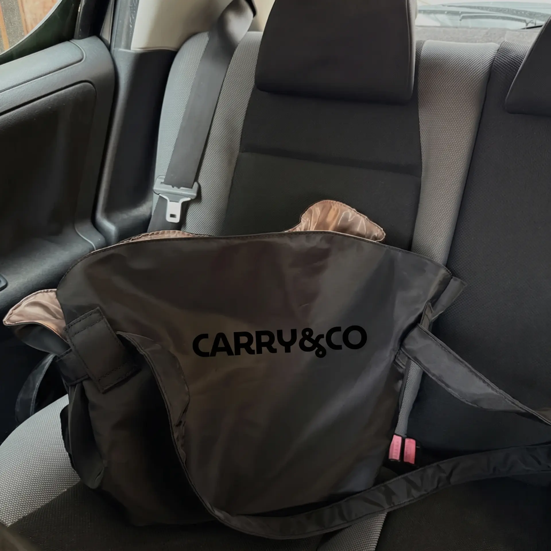 The bag folded on a car back seat