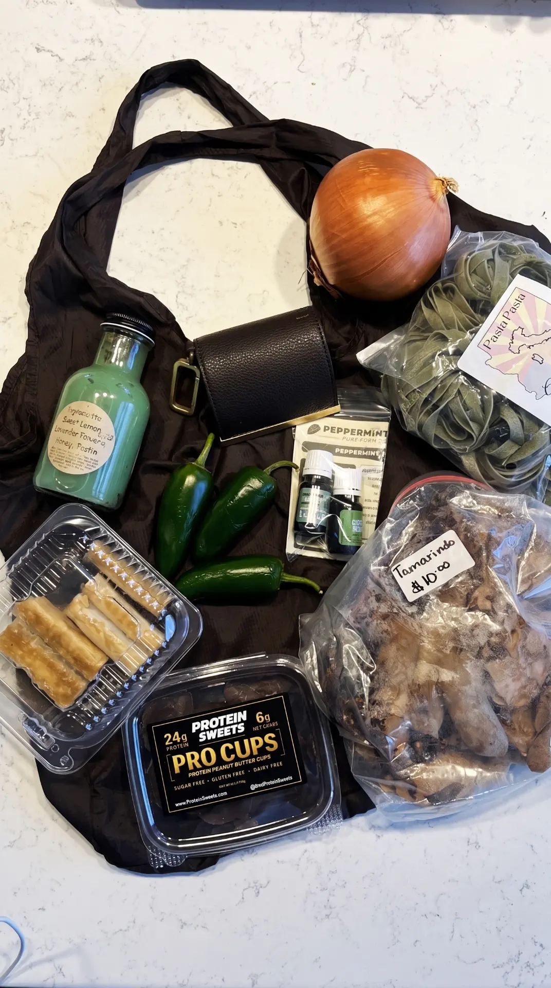 The cliptote laid out on a counter, loaded with groceries